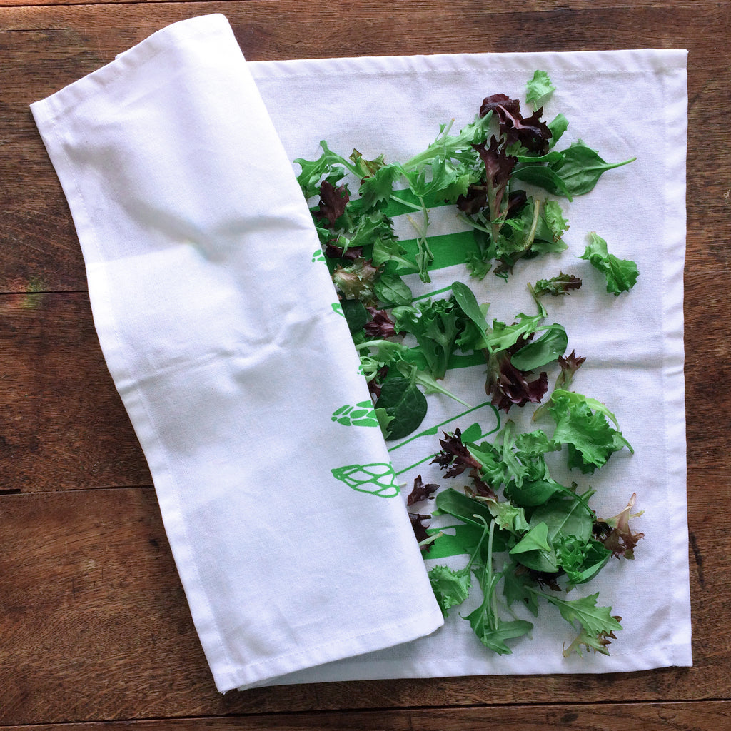 salad greens drying on a tea towel