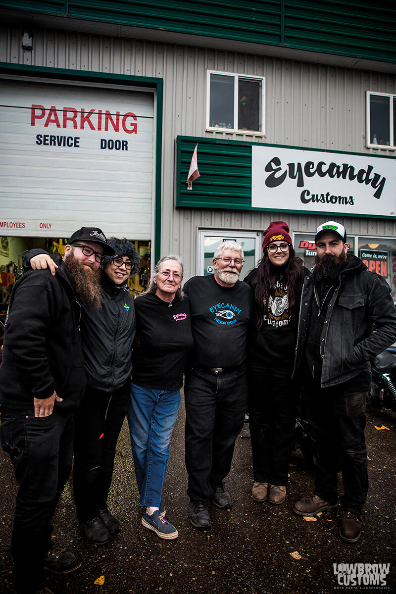 The crew visiting Smoking Sam and his wife at Eye Candy Customs to get a new tire for the red Dyna.