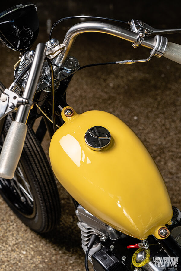 The VW yellow paint looks great alongside the white upholstery, oil tank and grips.