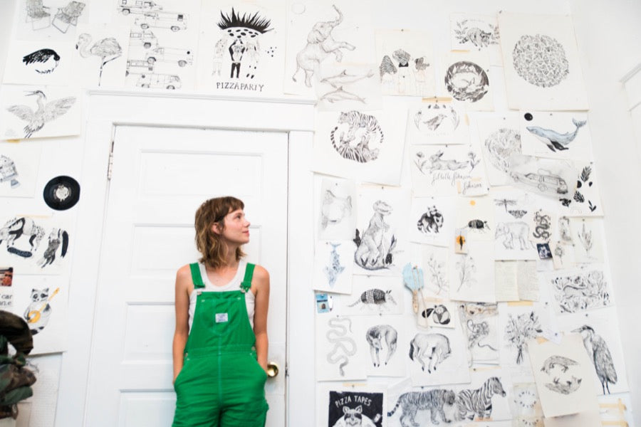 Nashville artist Emily Miller standing in her studio. 
