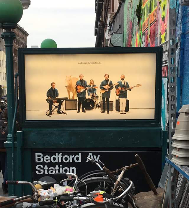 Real Esate band ad on the Bedford L train