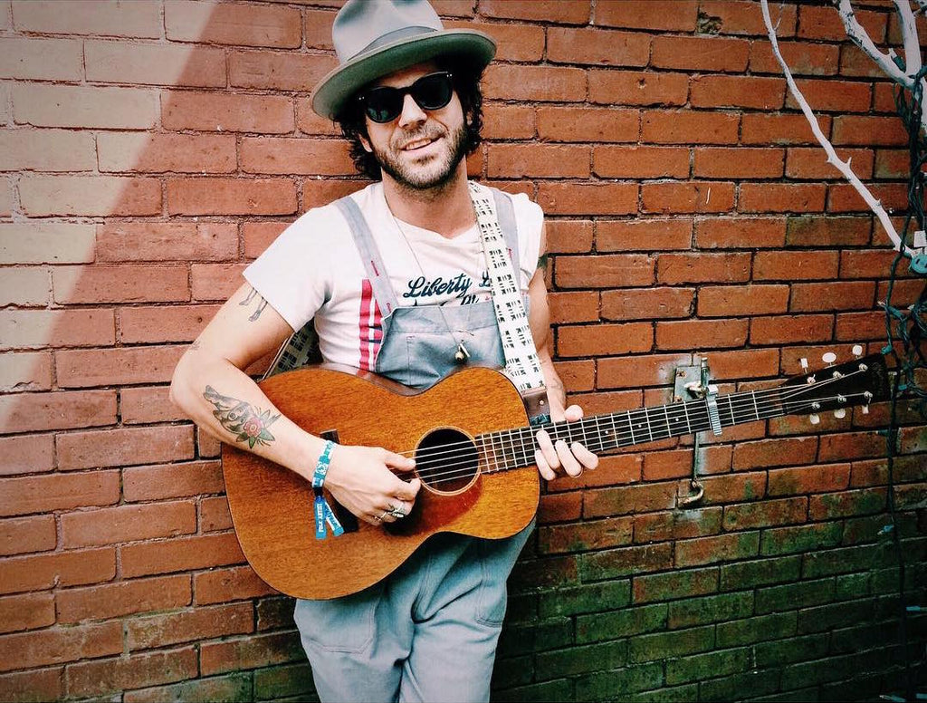 Langhorne Slim with his Martin guitar and an Indian guitar strap by Original Fuzz