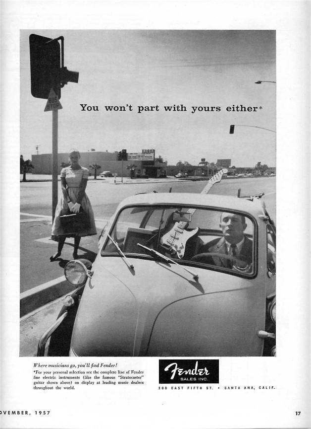 Vintage Fender 'You Won't Part With Yours Either' ad with a guy in traffic with a guitar in the passenger seat of his Volkswagon Beetle