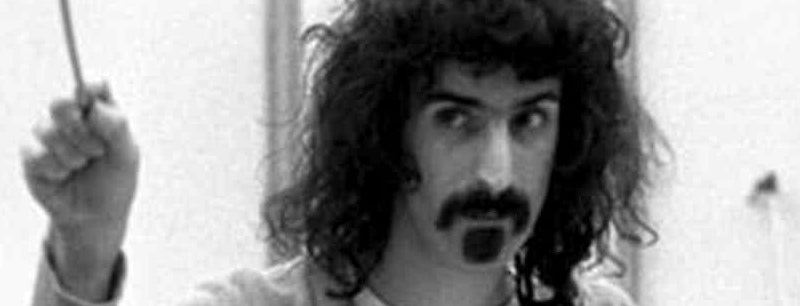 Frank Zappa conducts an orchestra