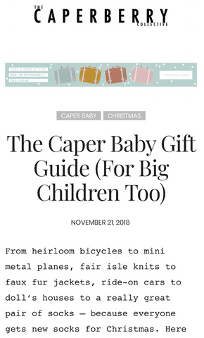 the caperberry collective baby gift guide featuring binibamba's blue rose sheepskin buggy liner