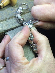 BSetting stones into a bracelet