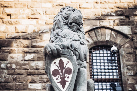 La Marzocco's seated lion with the crest of the Florentine Lily