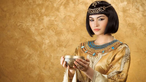 An Egyptian woman holding a bowl with wine for skin beauty and skin tightening