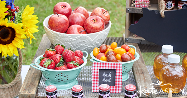Barbecue picnic table with tomatoes, apples and strawberries