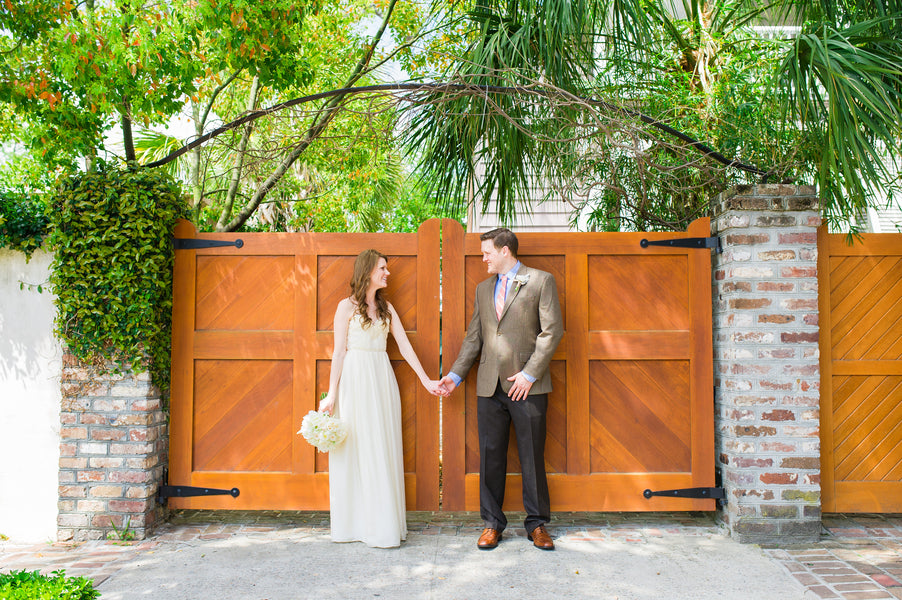 Bride and Groom Holding Hands | Peachy Pink Wedding in Historic Charleston | Priscilla Thomas Photography