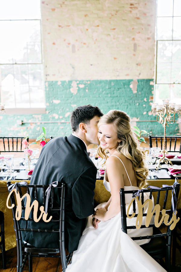 Bride and Groom Sitting at Table | Andie Freeman Photography