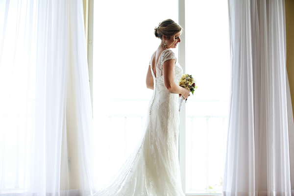 Bride in Wedding Dress in Window