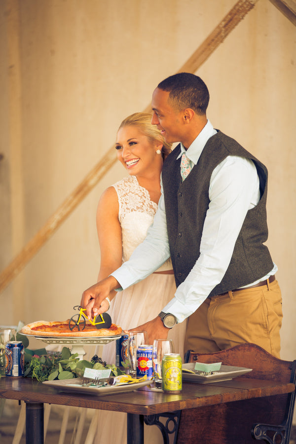 Bride and Groom Cut Pizza | Mountain Bike Industrial Themed Wedding Shoot | Lifestyle Photography