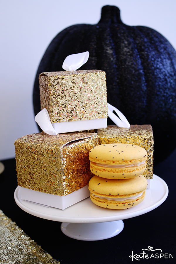 Orange Macarons in Gold Glitter Favor Boxes for Halloween | Kate Aspen