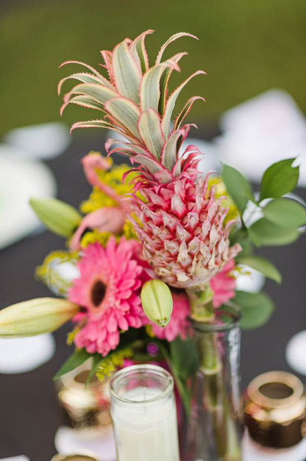 Mini pink pineapples create unique centerpieces for a retro engagement party | Two Prince Bakery Theater | Marc Edwards Photographs