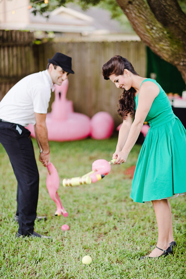 Flamingo croquet is a fun lawn game for a flamingo themed party! | A Retro Flamingo Engagement Party | Two Prince Bakery Theater | Marc Edwards Photographs