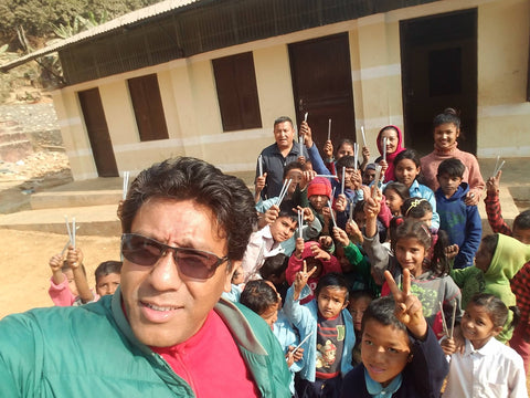 Raj from Adventure Thirdpole delivering our pencils to the kids in Nepal 