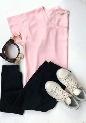 Bare Slumber Pink Pajama Top Paired with Black Jeans, Black Belt and White Sneakers. Very Comfortable and super stylish.