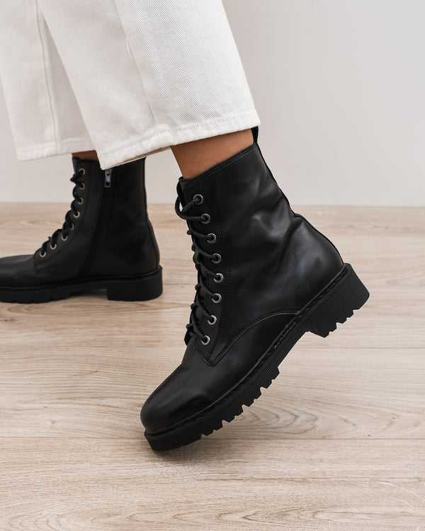 very flat black boots