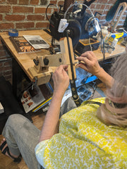 Christina hand stitching the collar