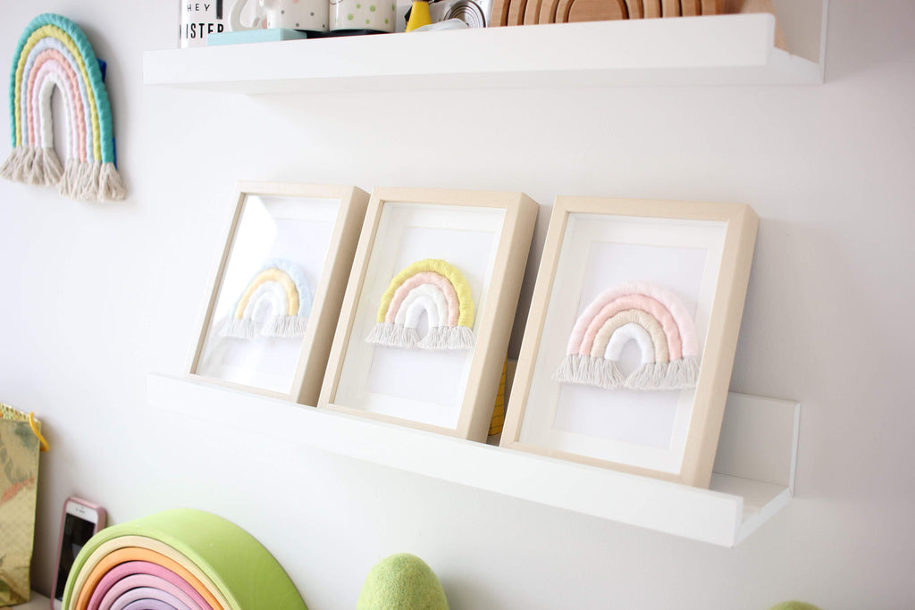 Three baby rainbows in IKEA frames