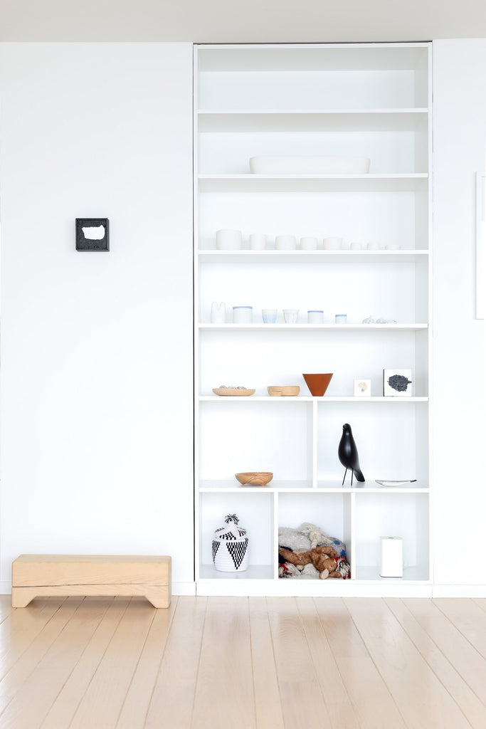 Modern, minimalist open shelving with artwork of Tina Frey and objects of art in Faunamade blog post