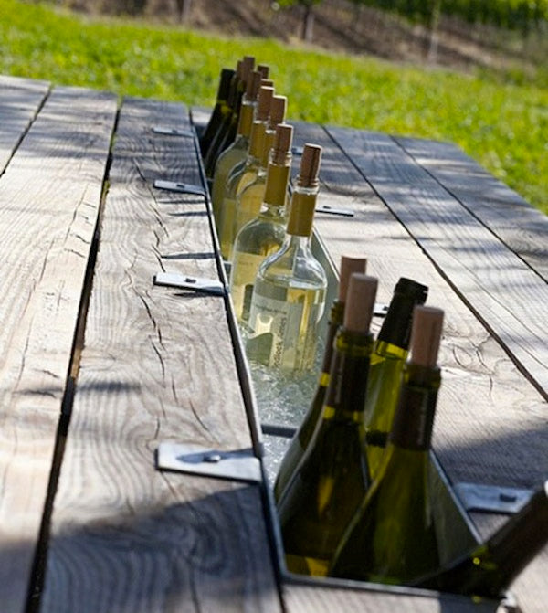 way to keep your drinks cool and your guests happy than a picnic table 