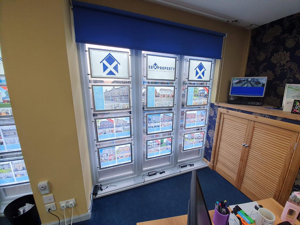 internal office showing estate agent window display