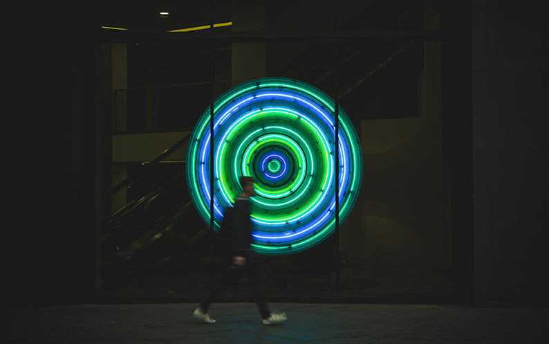 A boy exposed to blue and green lights