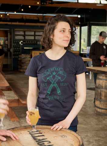 Emma wearing Loyal Citizen's "Crossed Hatchets" t-shirt while enjoying an Allagash.