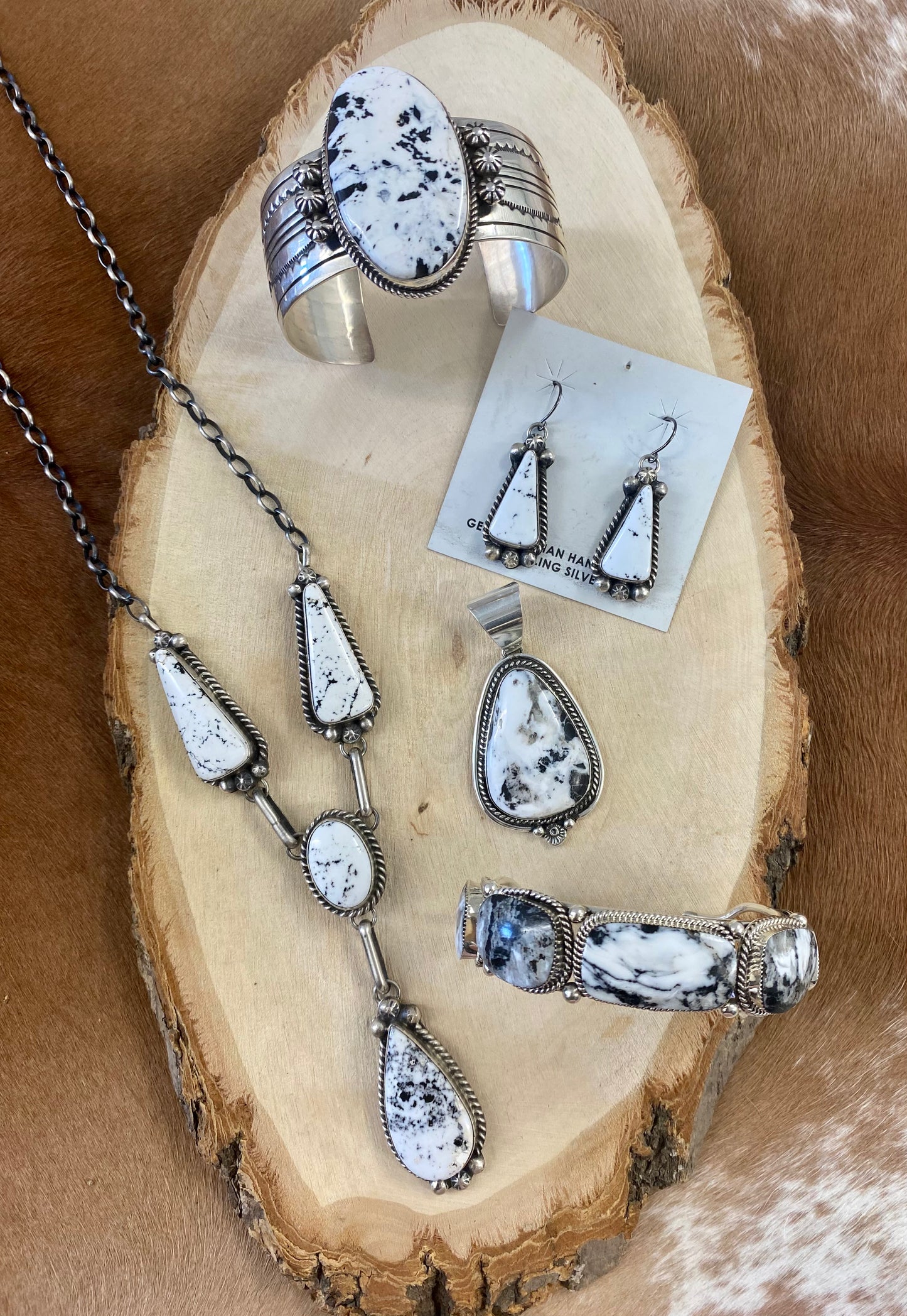 The perfect single-stone sterling silver unique Native American-made large White Buffalo pendant to add to any necklace. This piece will look gorgeous on a strand of Navajo pearls or a chain necklace. Stamped sterling and signed C Charley by Native artist silversmith. The perfect piece to add to your next outfit! Size: 1 3/4” inches in length without bale, bale 1/2” inch. 1 1/4" inches in width Signed: YES "C. Charley" Hallmark/ Artist: C. Charley Stone: White Buffalo