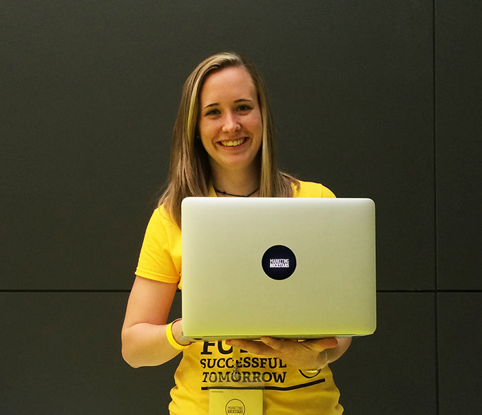 marketing rockstars volunteer with a custom tabtag glowing on her macbook 