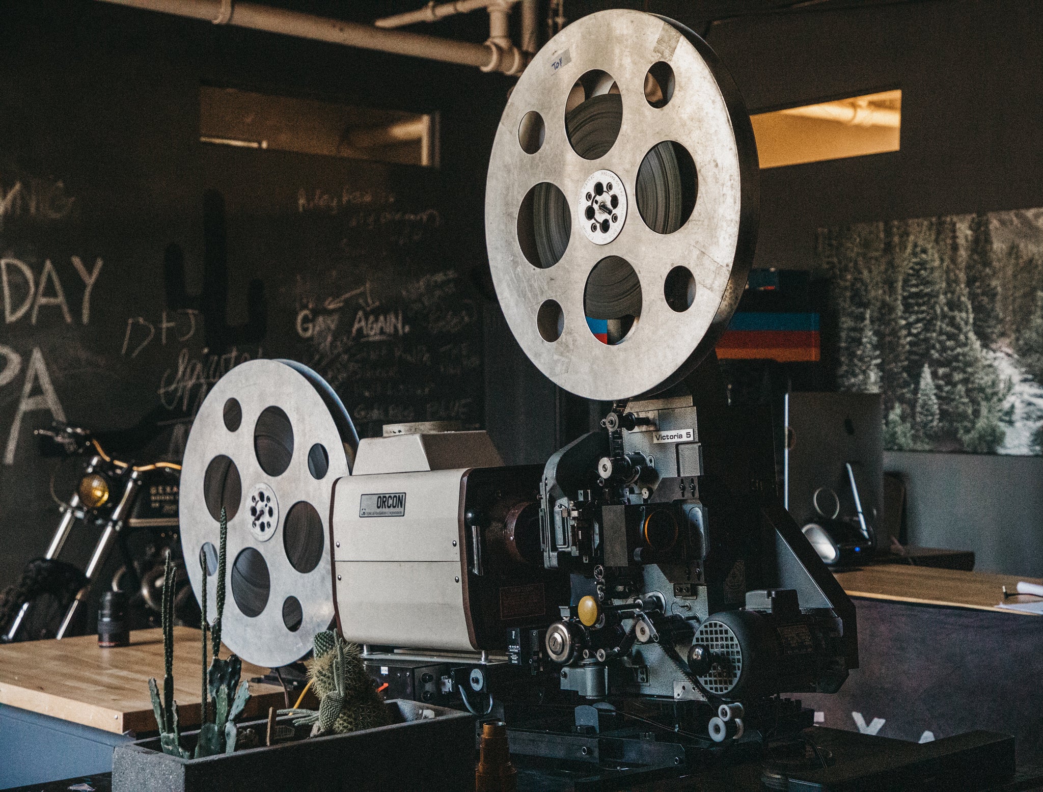 35mm projector set up with film in a workshop