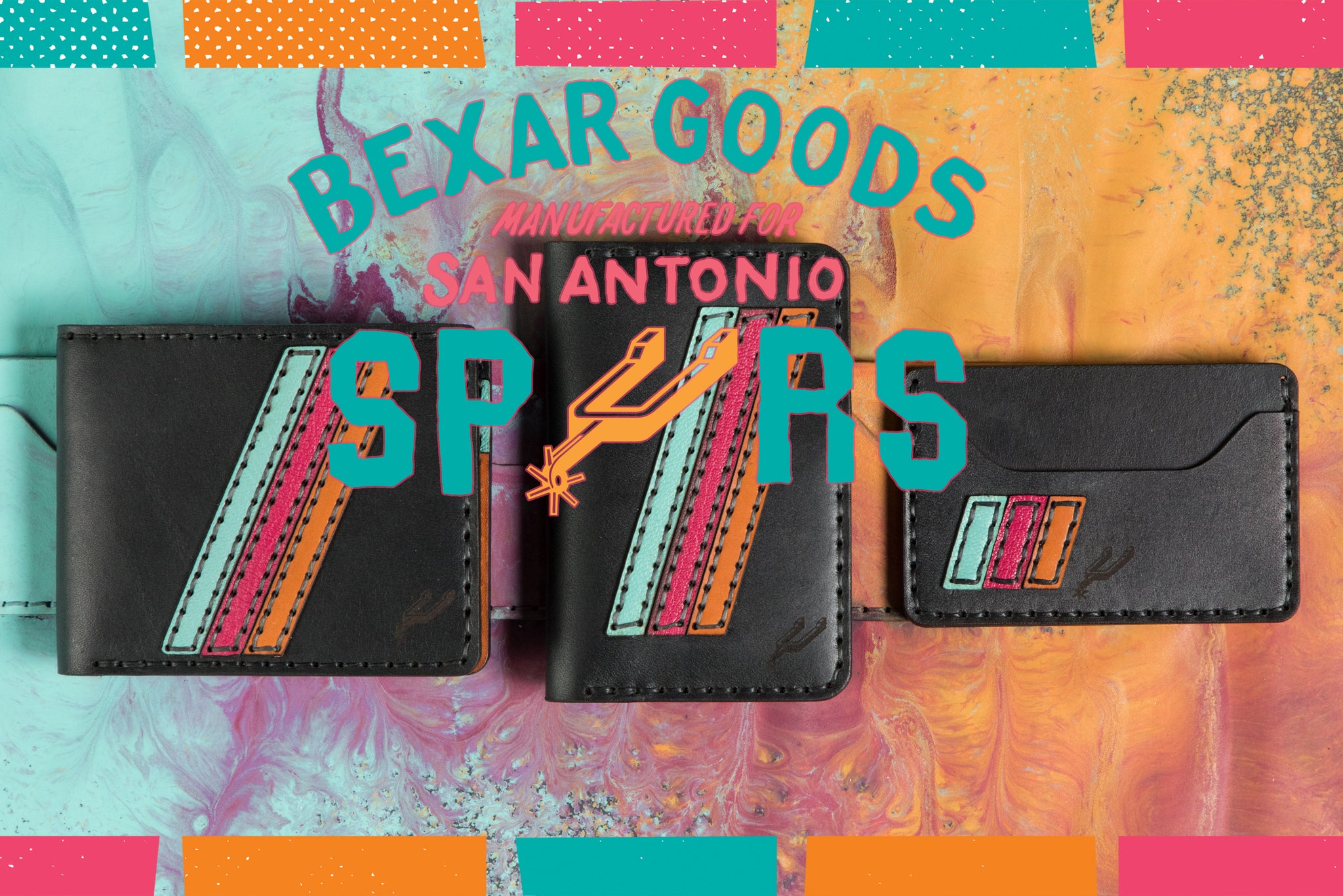 3 Spurs x Bexar Goods collaboration wallets sit on top of a colorful fiesta style splatter of paint