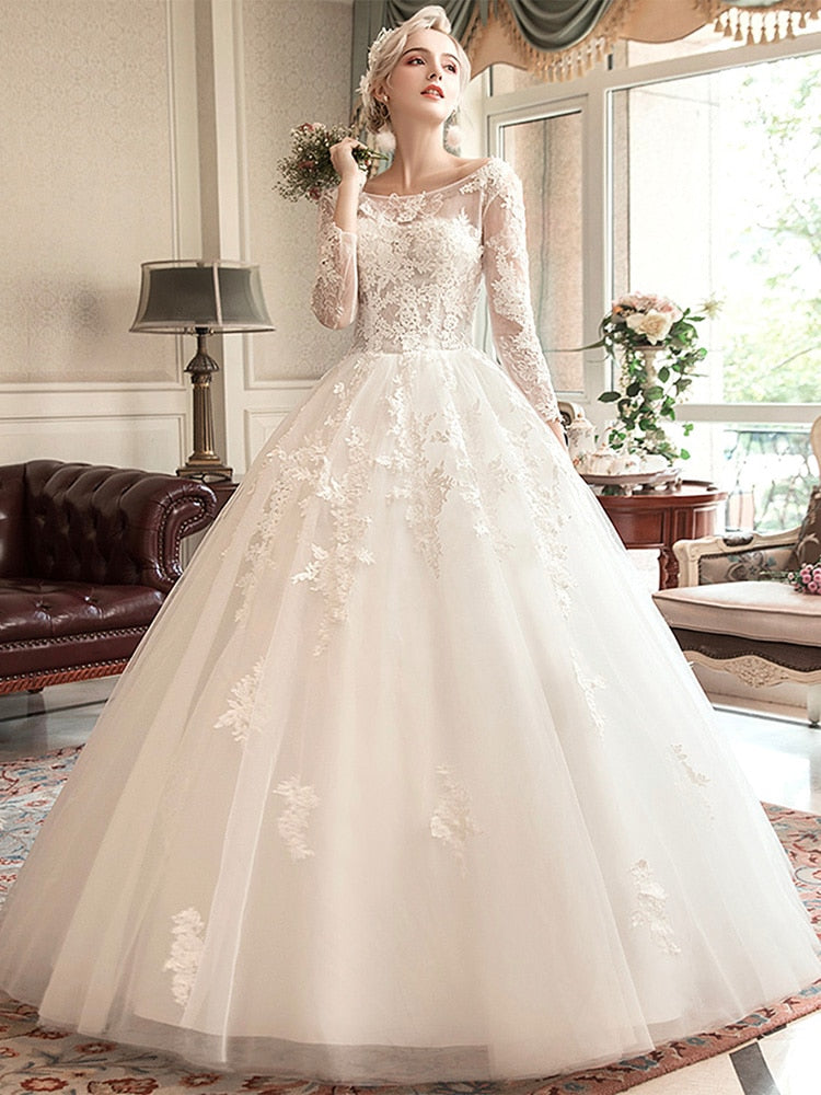 A-line wedding dress with illusion bodice and long sleeves