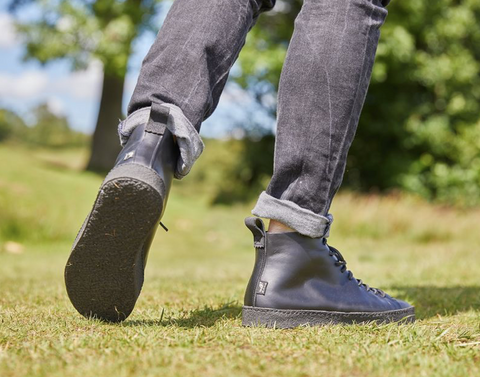 Black Yogi Footwear boots in a field