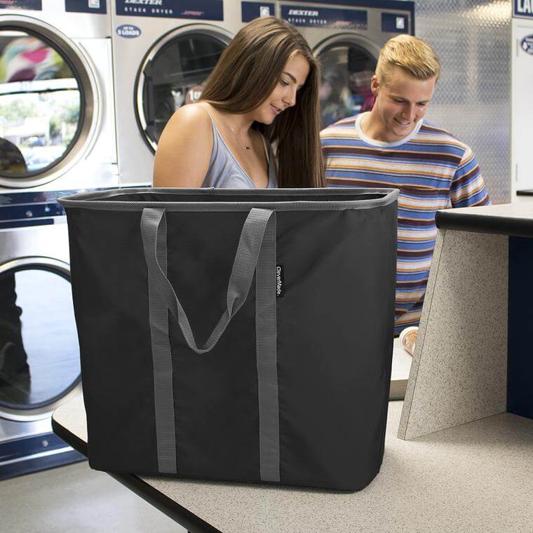 college students in a laundry mat with the Laundry Caddy