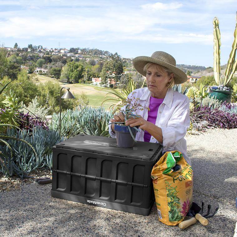 Woman gardening with CleverCrate® Storage Bin with Lid