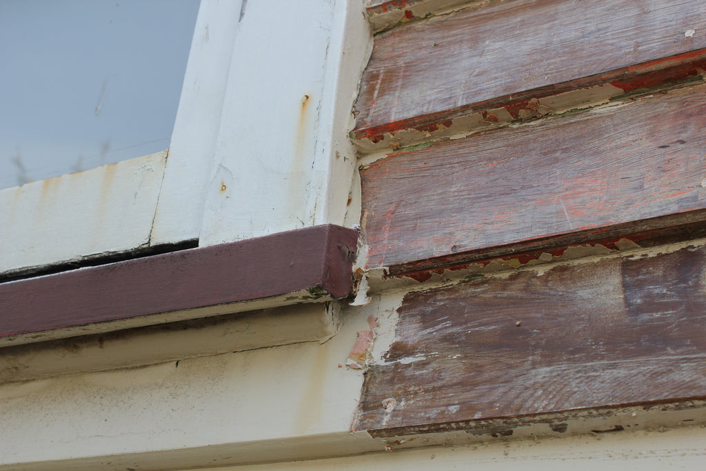 Stripping paint off of house with heat gun 