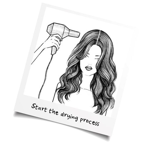 girl blow drying hair