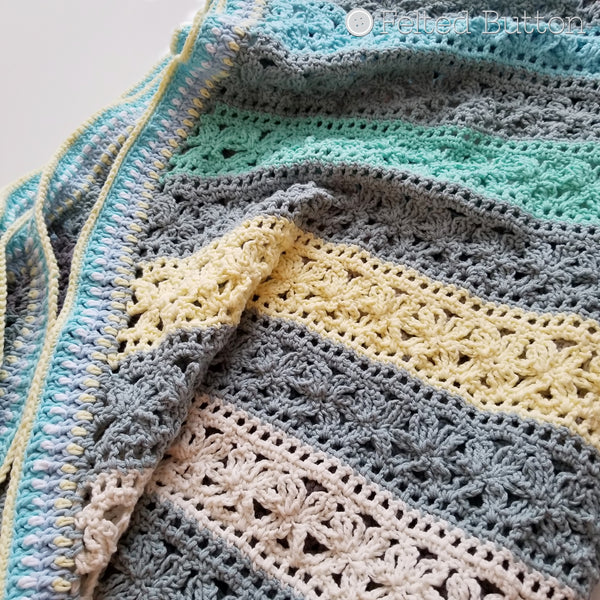Under the Awning Blanket crochet pattern by Susan Carlson of Felted Button | Colorful Crochet Patterns | cabana striped cotton baby blanket throw or afghan in blues, yellows and grays
