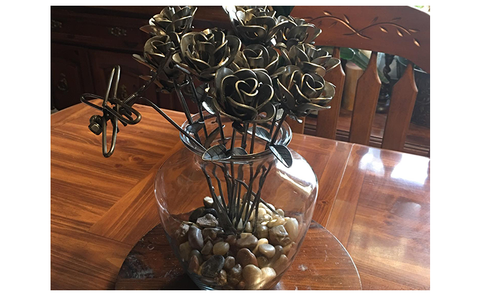One dozen roses and a dragonfly as a centerpiece for a kitchen table in Afton, NY.