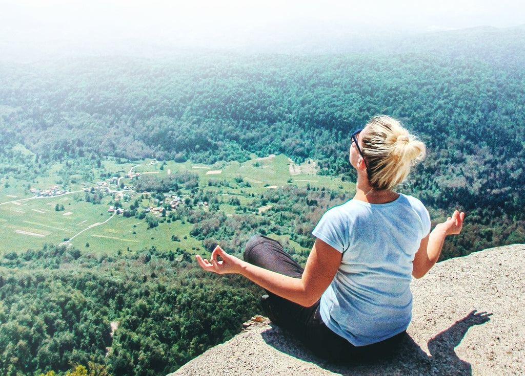 woman meditate mountain sun