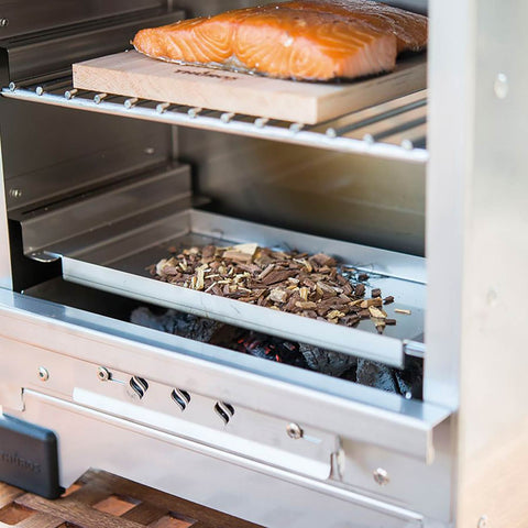 Salmon and wood chips in a smoker