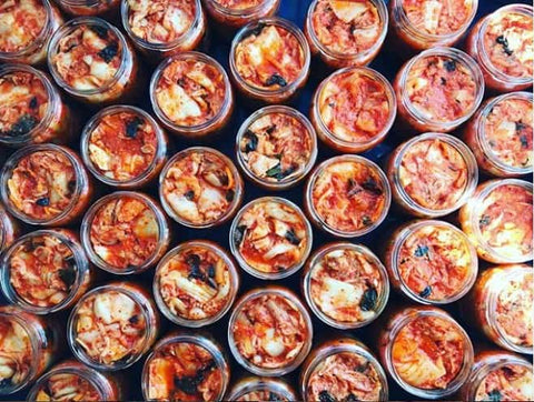 An overhead shot of kimchi in jars