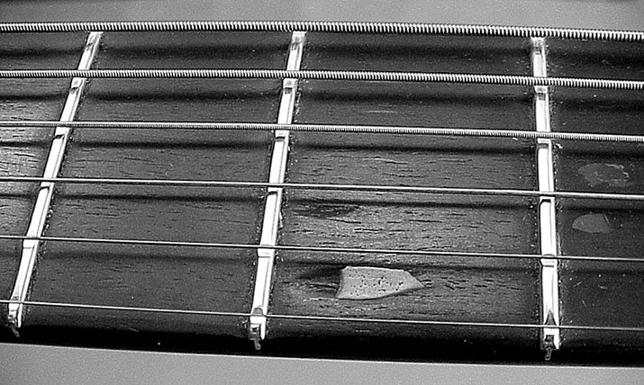 a worn fingerboard