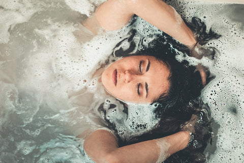 Women relaxing in a bubble bath