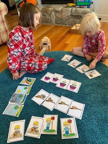 Homeschooling in the Methow Montessori style week one. Coco and Pearl work with materials.