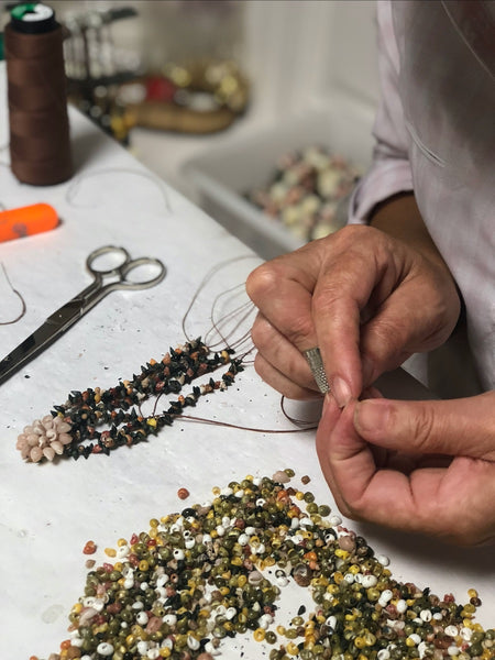 The "colareiras", shells necklace makers who gather the shells on the beaches and hand-embroidered our shells flowers and jewelry in O Grove (Galicia)