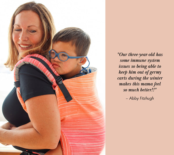 A mother is carrying her child in a Preschool Carrier in back-carry position. Next to her is a quote.